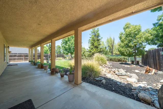a view of a house with a yard and porch