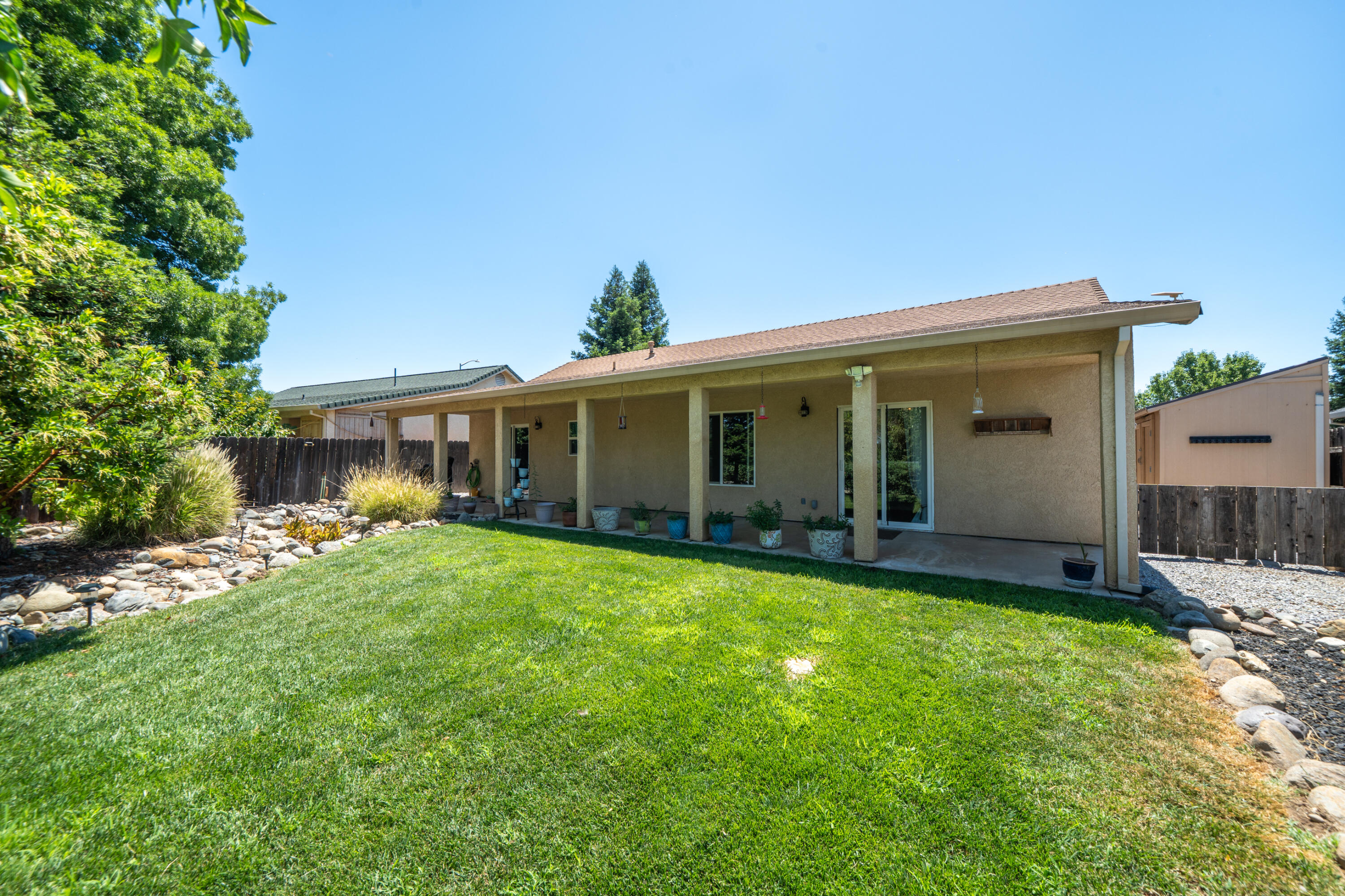 3388 Oak Street Anderson, CA 96007 - Photo 26 of 36 a view of a house with a yard and porch
