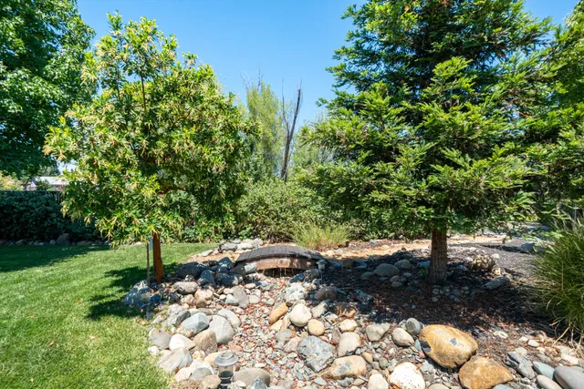a view of a house with a backyard