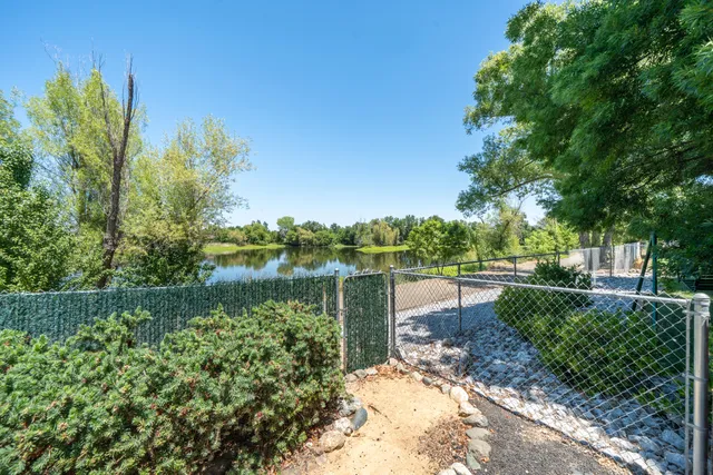 a view of a lake with a house in the background