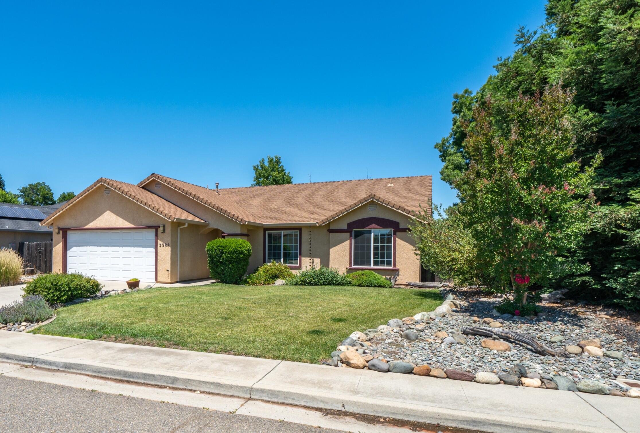 3388 Oak Street Anderson, CA 96007 - Photo 32 of 36 a front view of a house with a garden