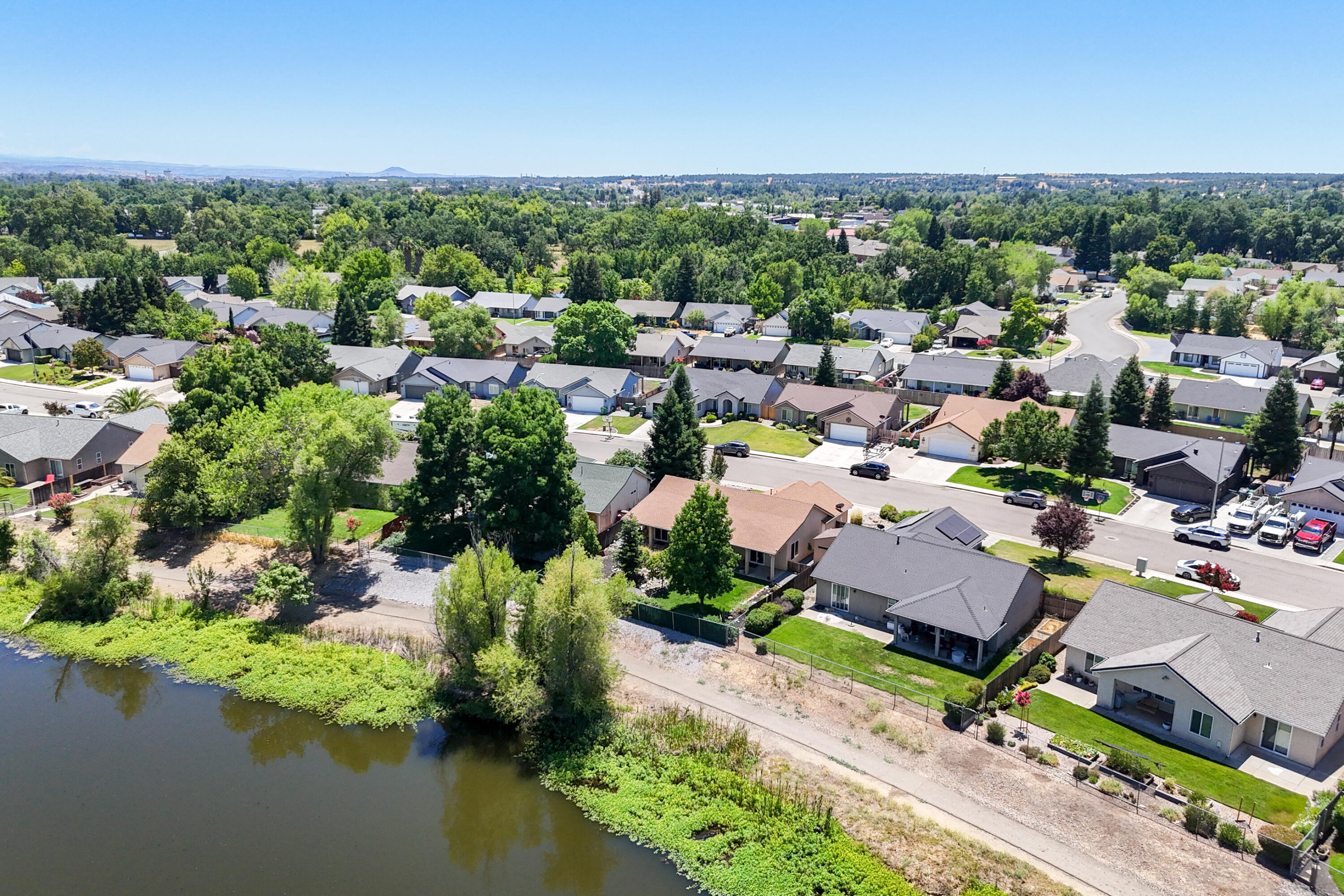 3388 Oak Street Anderson, CA 96007 - Photo 35 of 36 an aerial view of a houses with a lake view