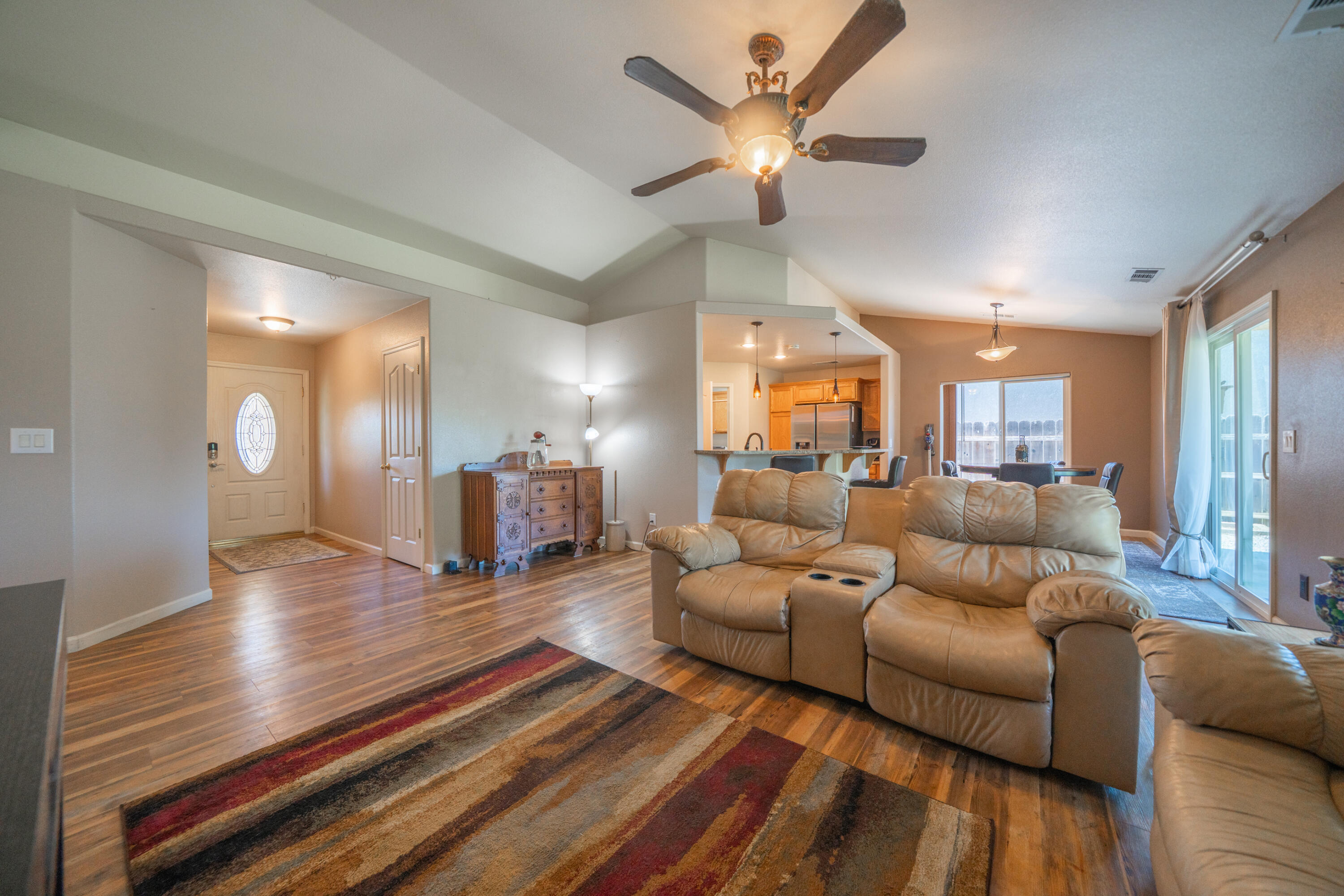 3388 Oak Street Anderson, CA 96007 - Photo 6 of 36 a living room with furniture and a chandelier