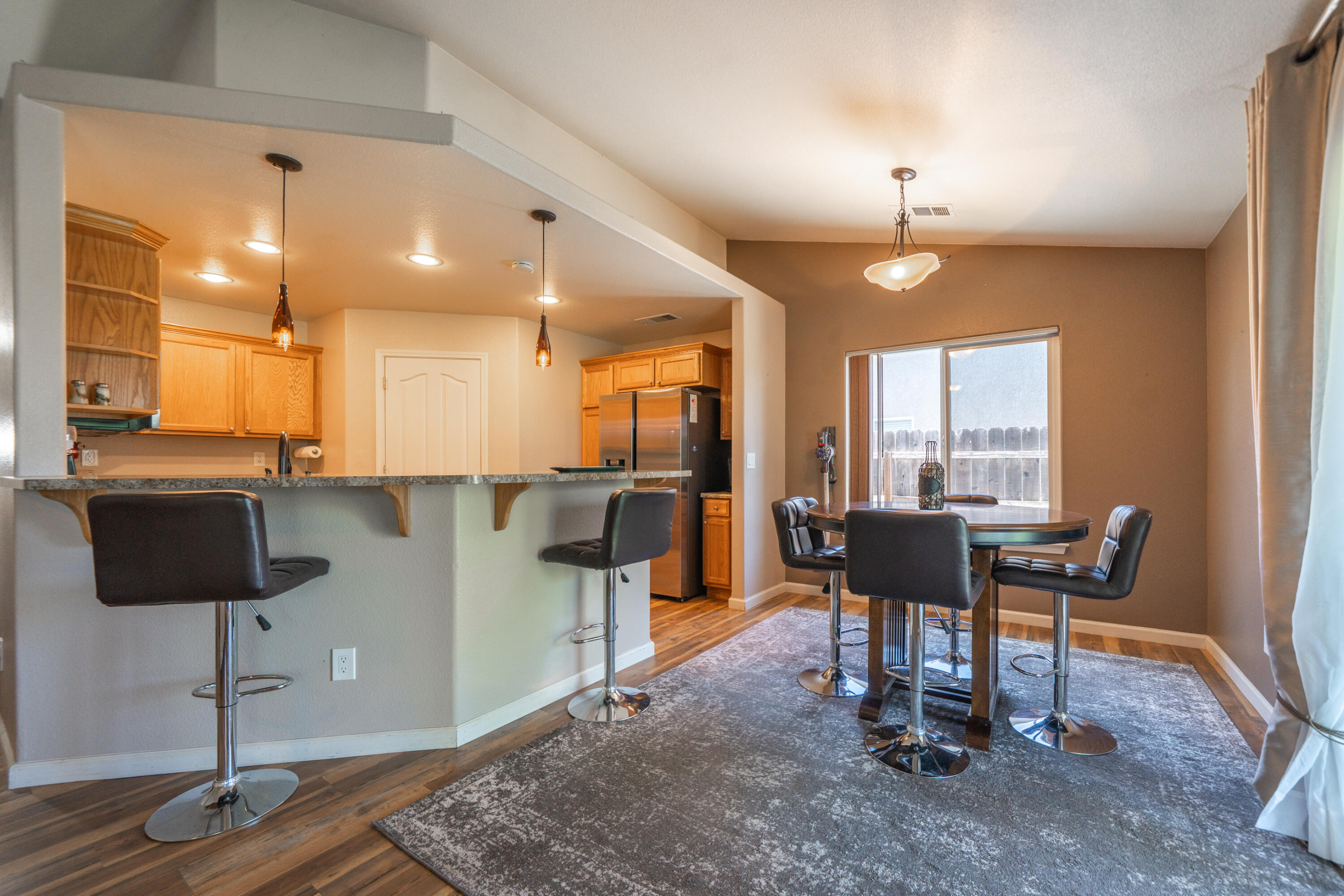 3388 Oak Street Anderson, CA 96007 - Photo 7 of 36 a view of a dining room with furniture