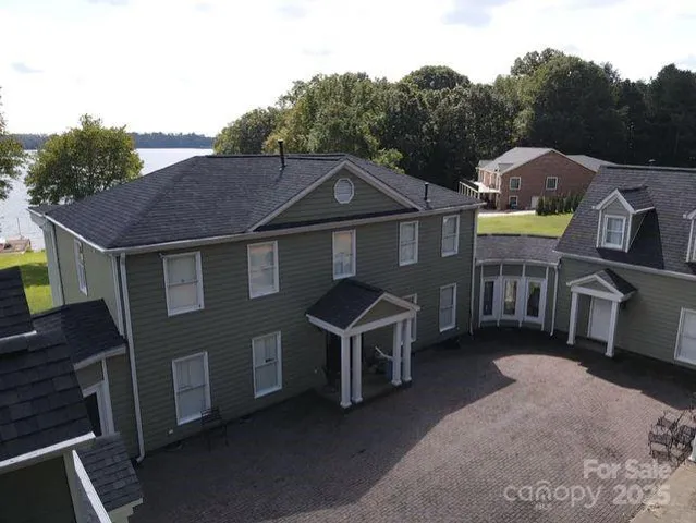 a front view of house with yard outdoor seating and mountain view