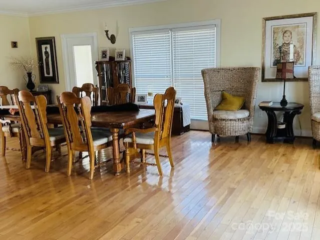 a view of entryway livingroom and hall with wooden floor