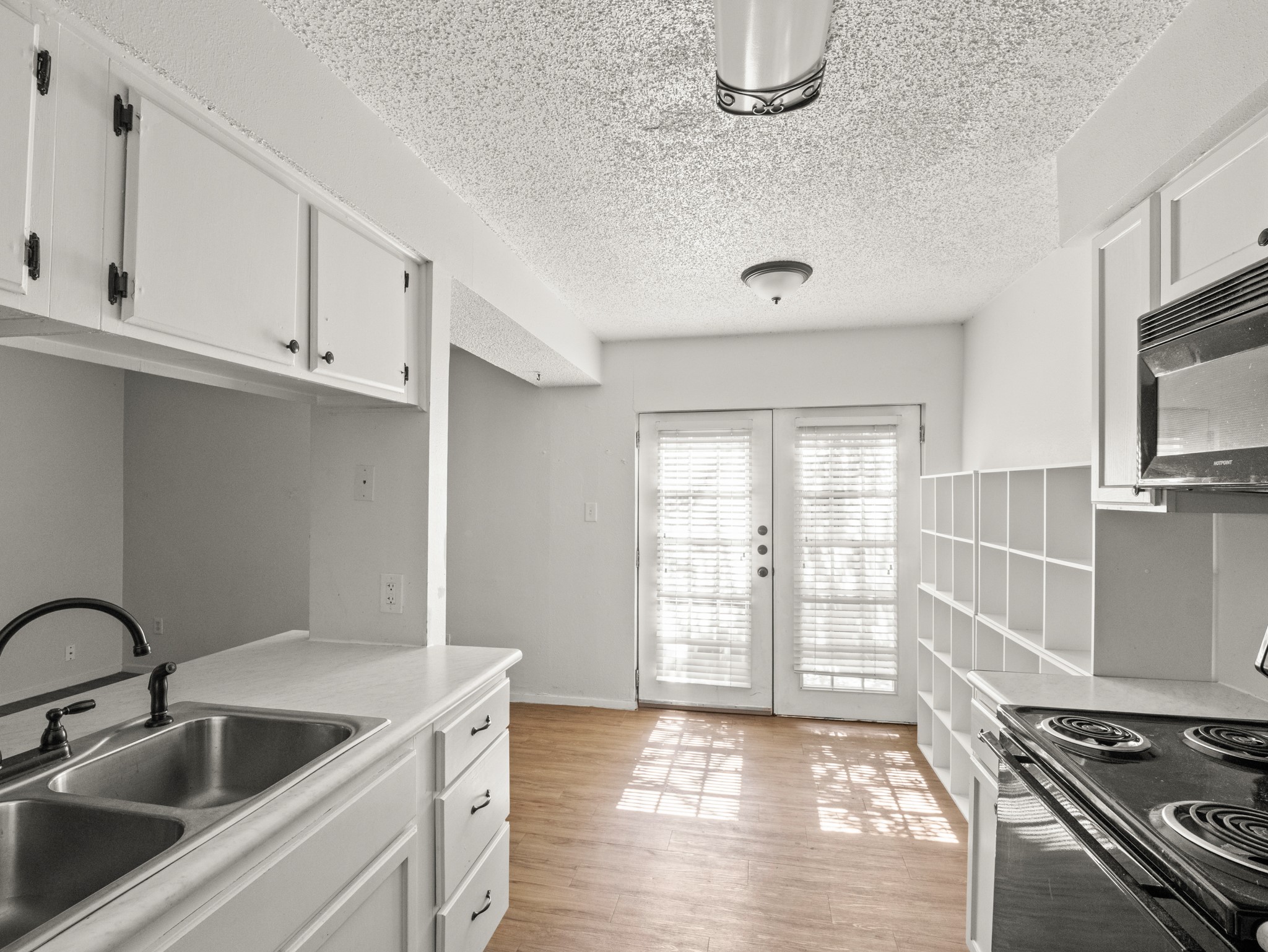 3507 Alpine Circle, Unit 3 Austin, TX 78704 - Photo 4 of 9 a kitchen with stainless steel appliances granite countertop a sink and a stove