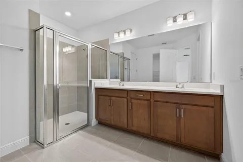 a bathroom with a double vanity sink mirror and double