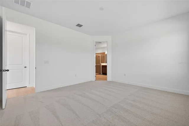 a kitchen that has a sink a stove and a microwave oven in it