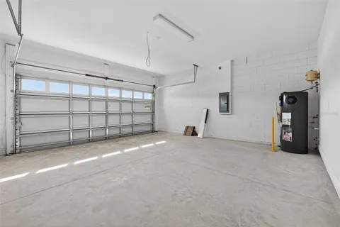 a aerial view of a house next to a yard