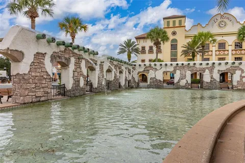 a view of a swimming pool with lounge chairs