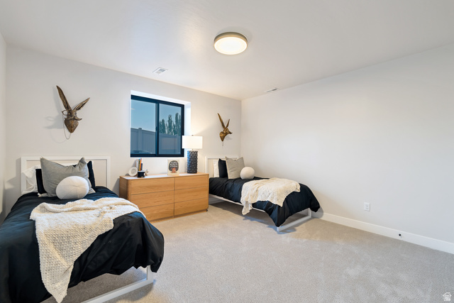 2145 North Main Street Centerville, UT 84014 - Photo 43 of 53 Bedroom with light colored carpet and baseboards
