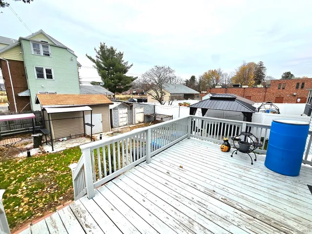 a view of balcony with deck and wooden floor
