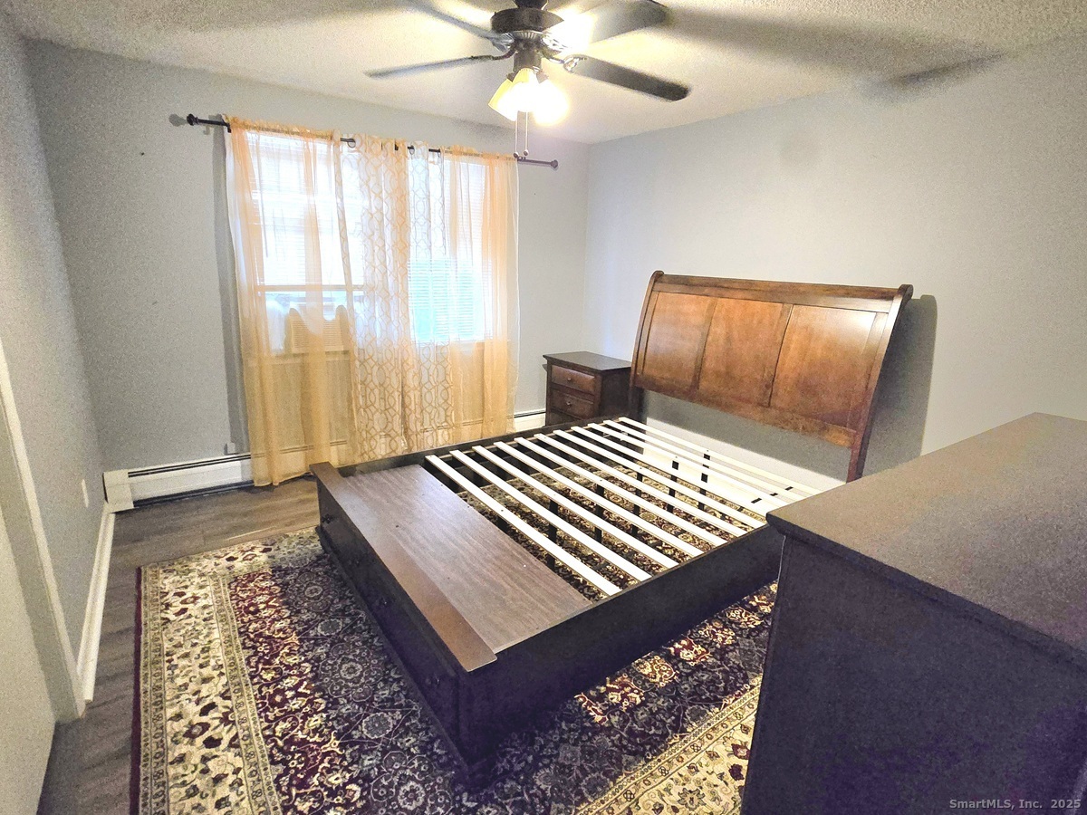 24 Acorn Street, Unit 2 New Britain, CT 06051 - Photo 6 of 12 a bedroom with a bed and a window