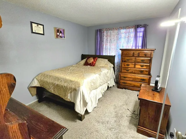 a bedroom with two beds and painted walls