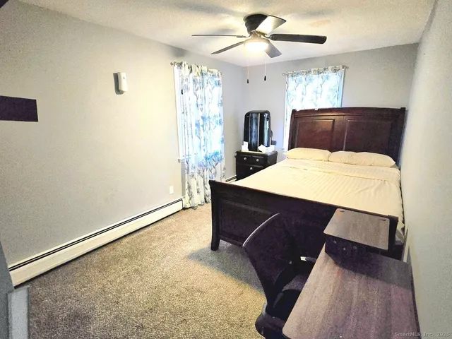 a room with a bed and a chandelier