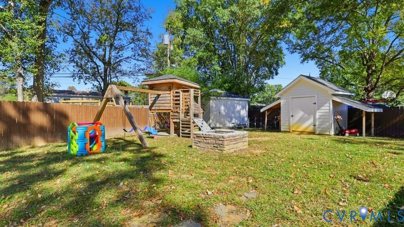 2962 Gaffney Road North Chesterfield, VA 23237 - Photo 4 of 37 Fenced backyard featuring a playground and a stora