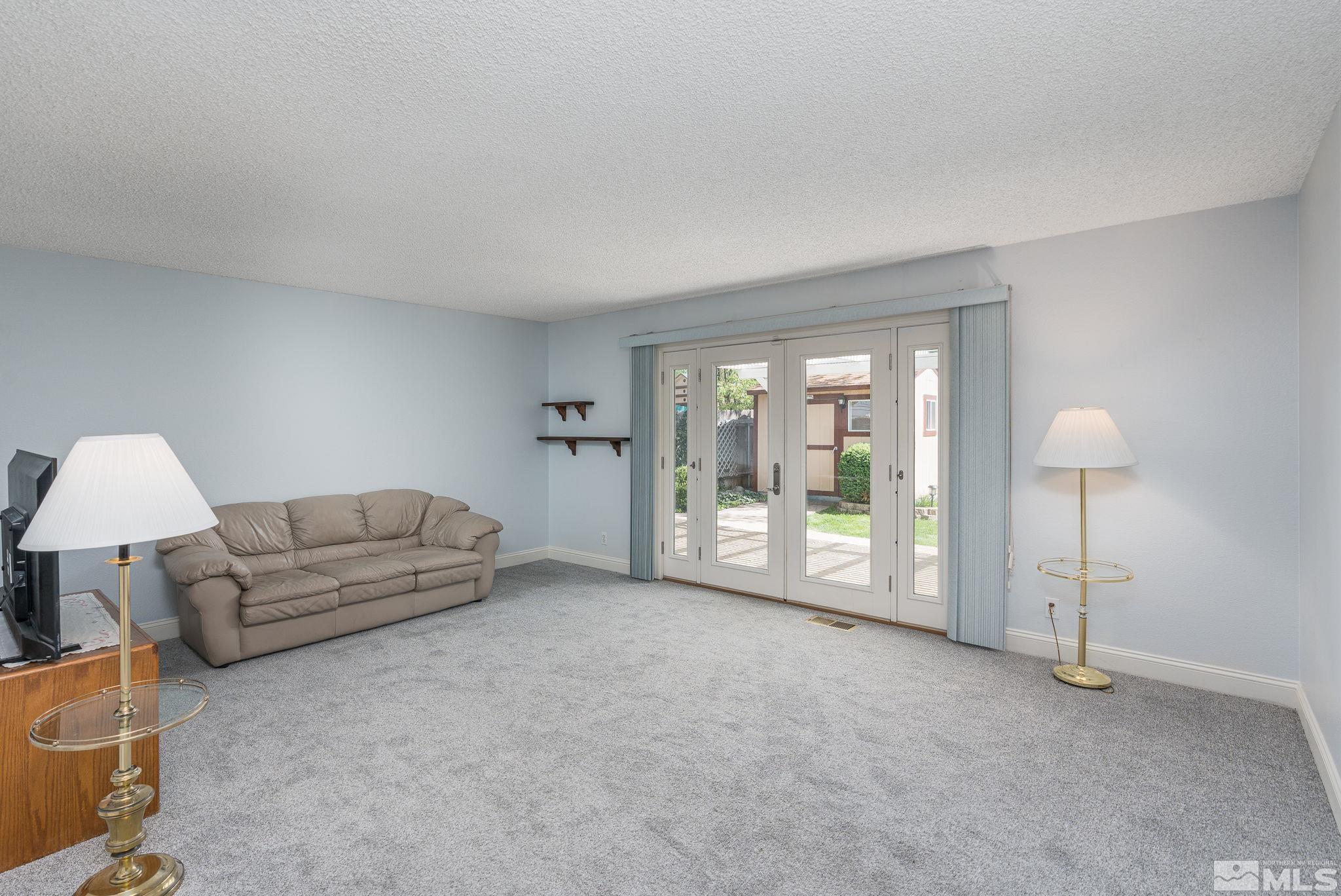 1065 Beldon Way Reno, NV 89503 - Photo 13 of 35 a living room with furniture and a lamp