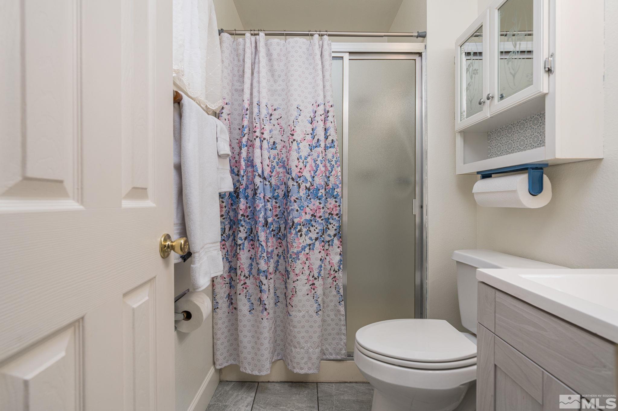 1065 Beldon Way Reno, NV 89503 - Photo 19 of 35 a bathroom with a shower toilet and sink