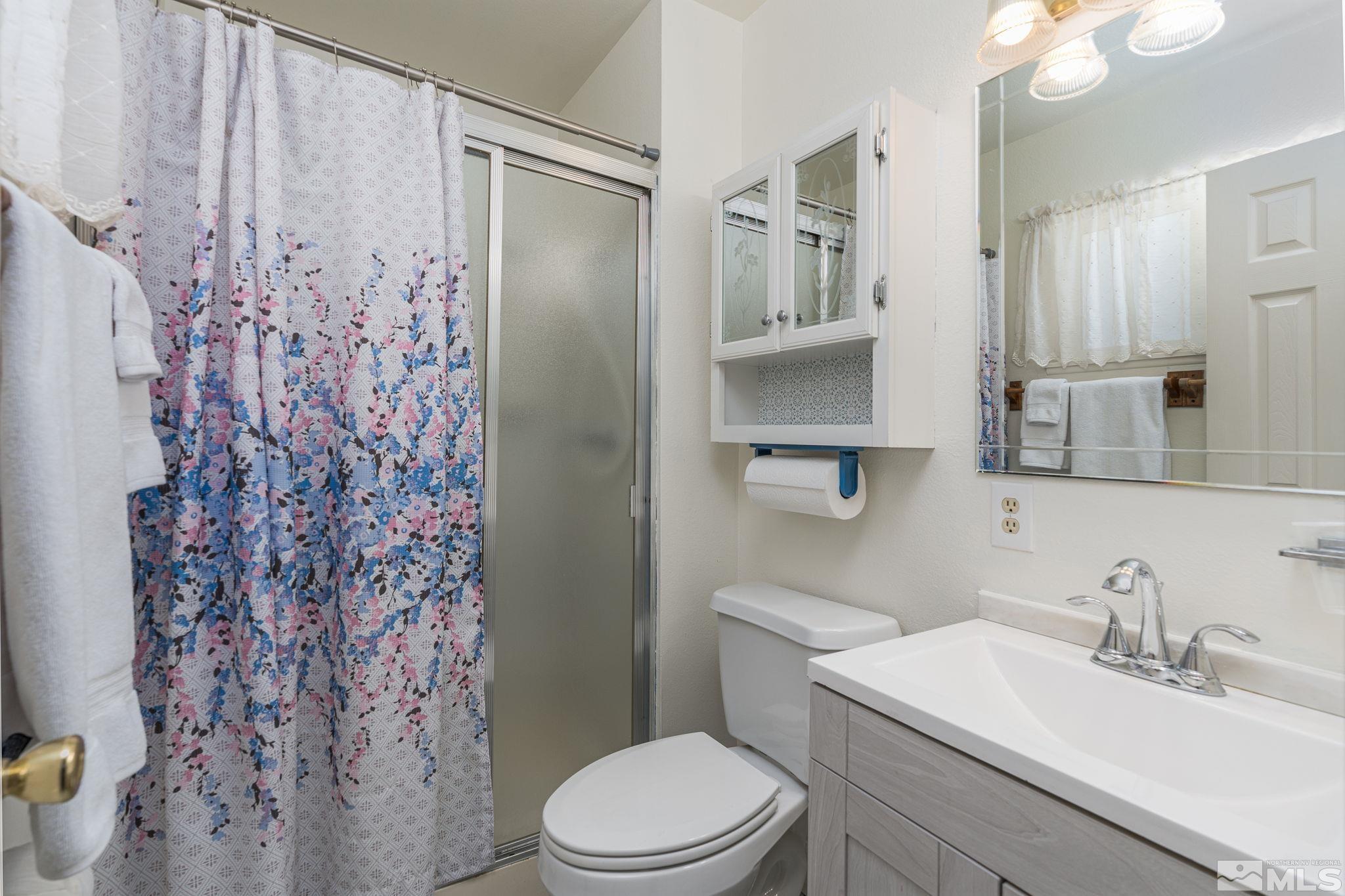 1065 Beldon Way Reno, NV 89503 - Photo 20 of 35 a bathroom with a sink toilet and shower
