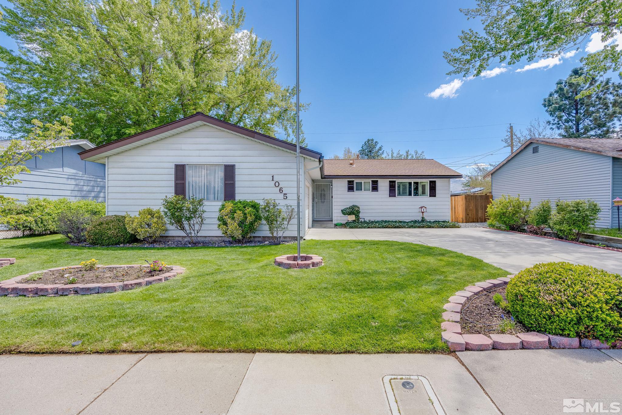 1065 Beldon Way Reno, NV 89503 - Photo 2 of 35 a house view with swimming pool and garden space