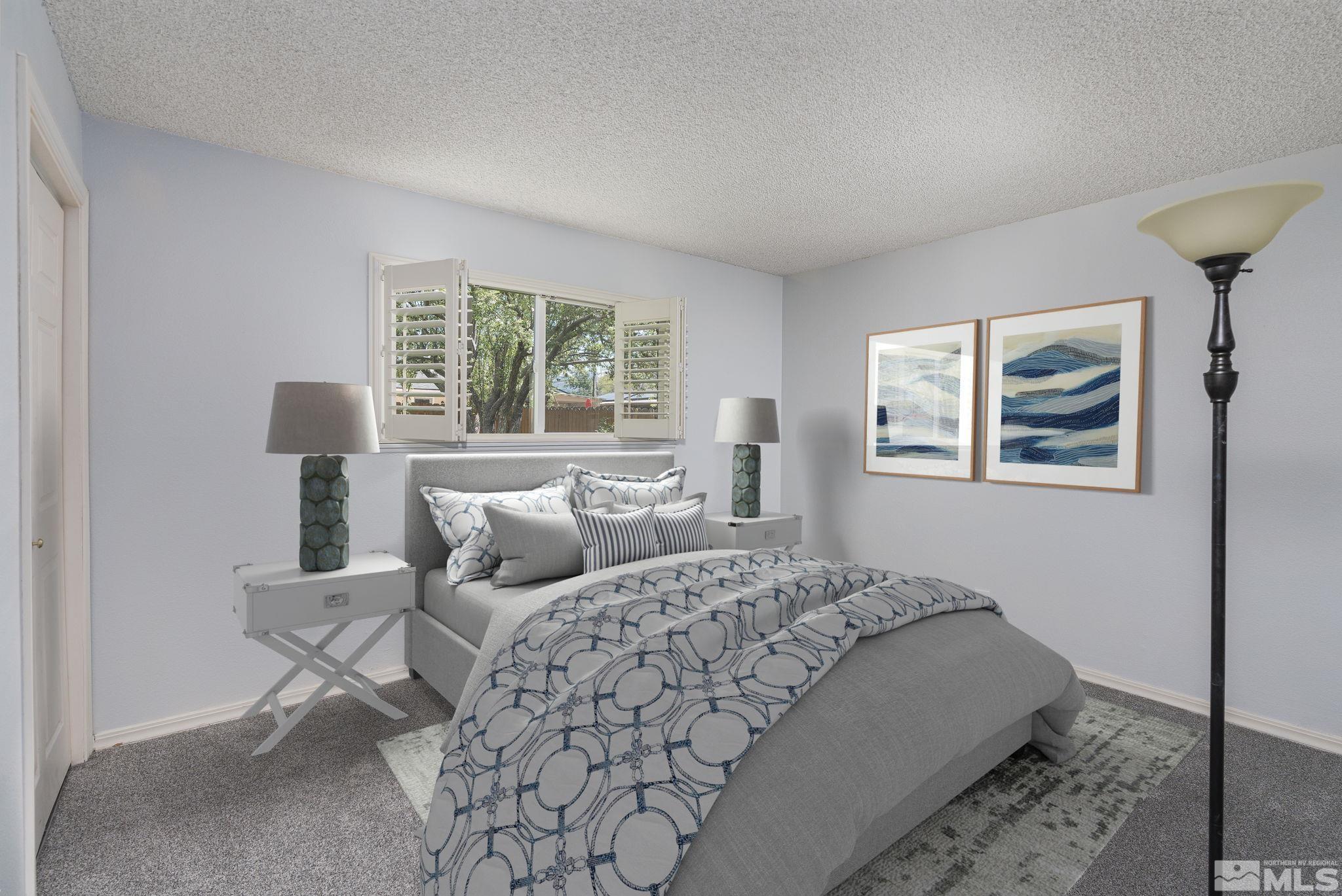 1065 Beldon Way Reno, NV 89503 - Photo 25 of 35 a bedroom with a bed and glass window