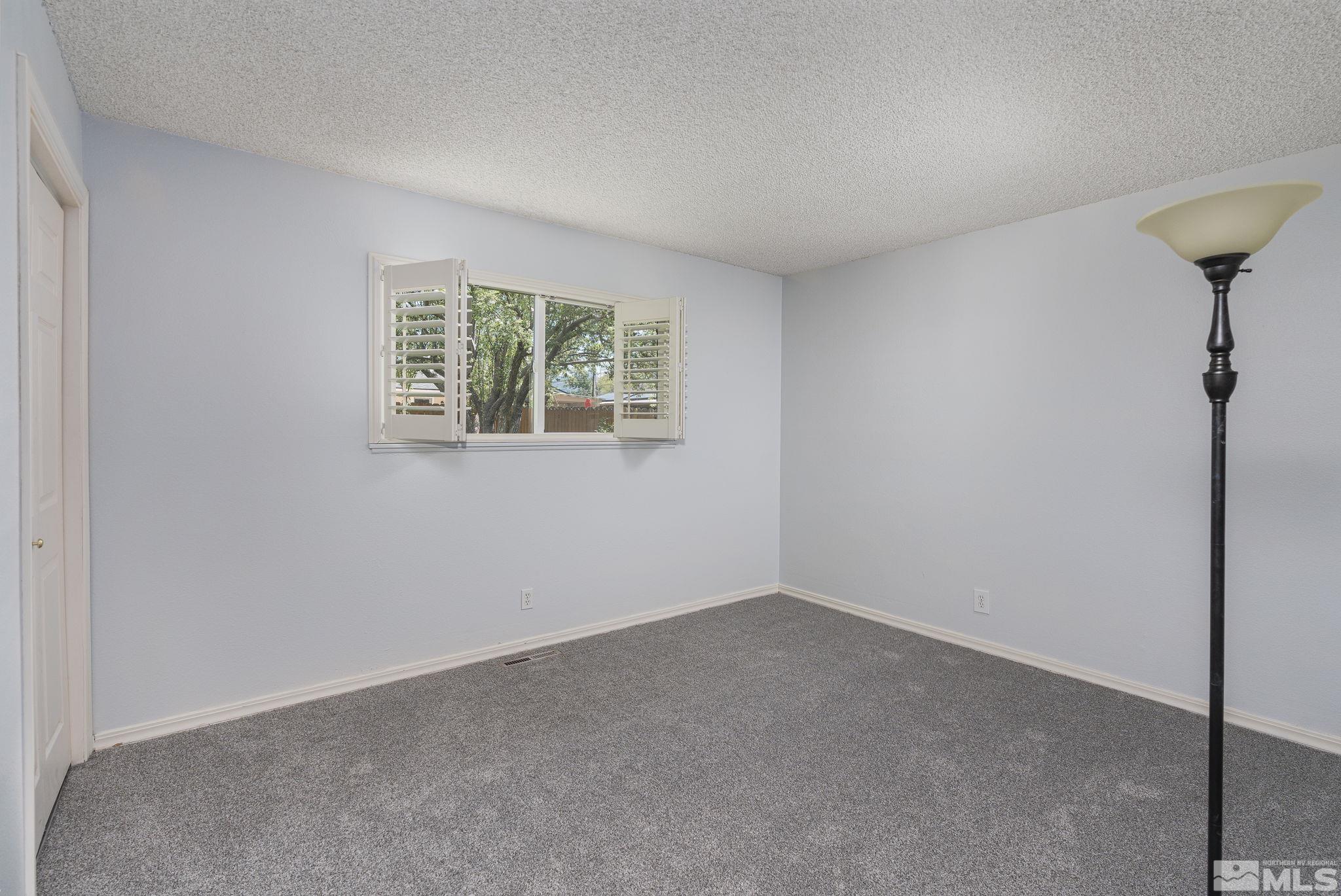 1065 Beldon Way Reno, NV 89503 - Photo 26 of 35 a view of an empty room with a window