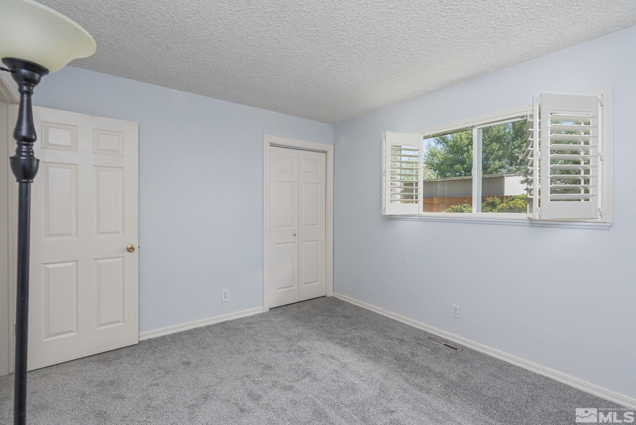 1065 Beldon Way Reno, NV 89503 - Photo 27 of 35 a view of an empty room with a window