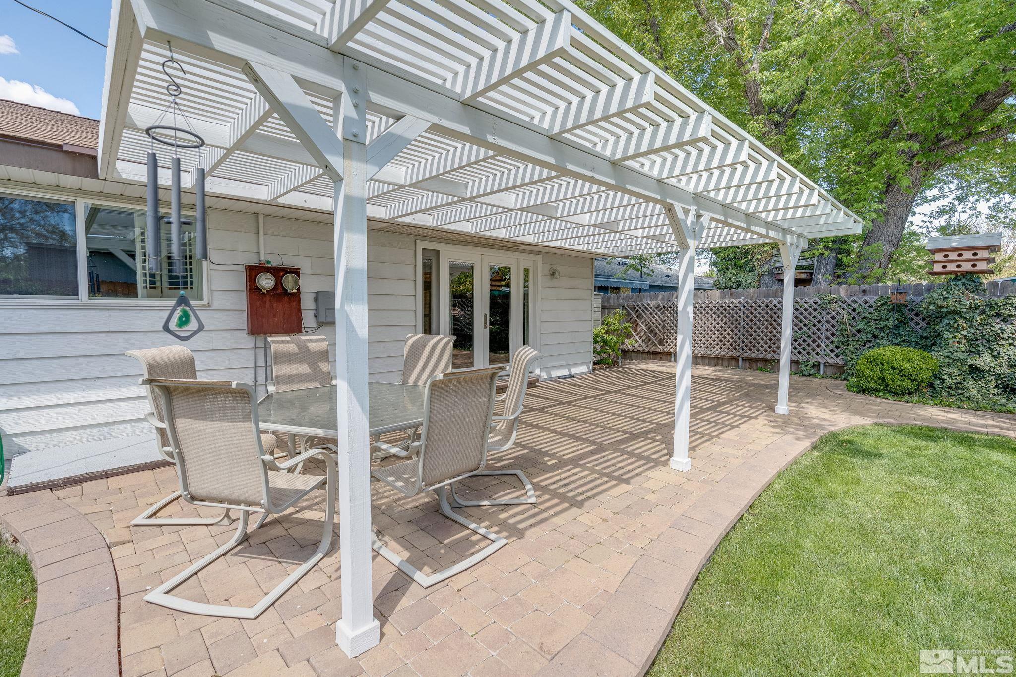 1065 Beldon Way Reno, NV 89503 - Photo 32 of 35 a view of a patio with table and chairs and potted plants