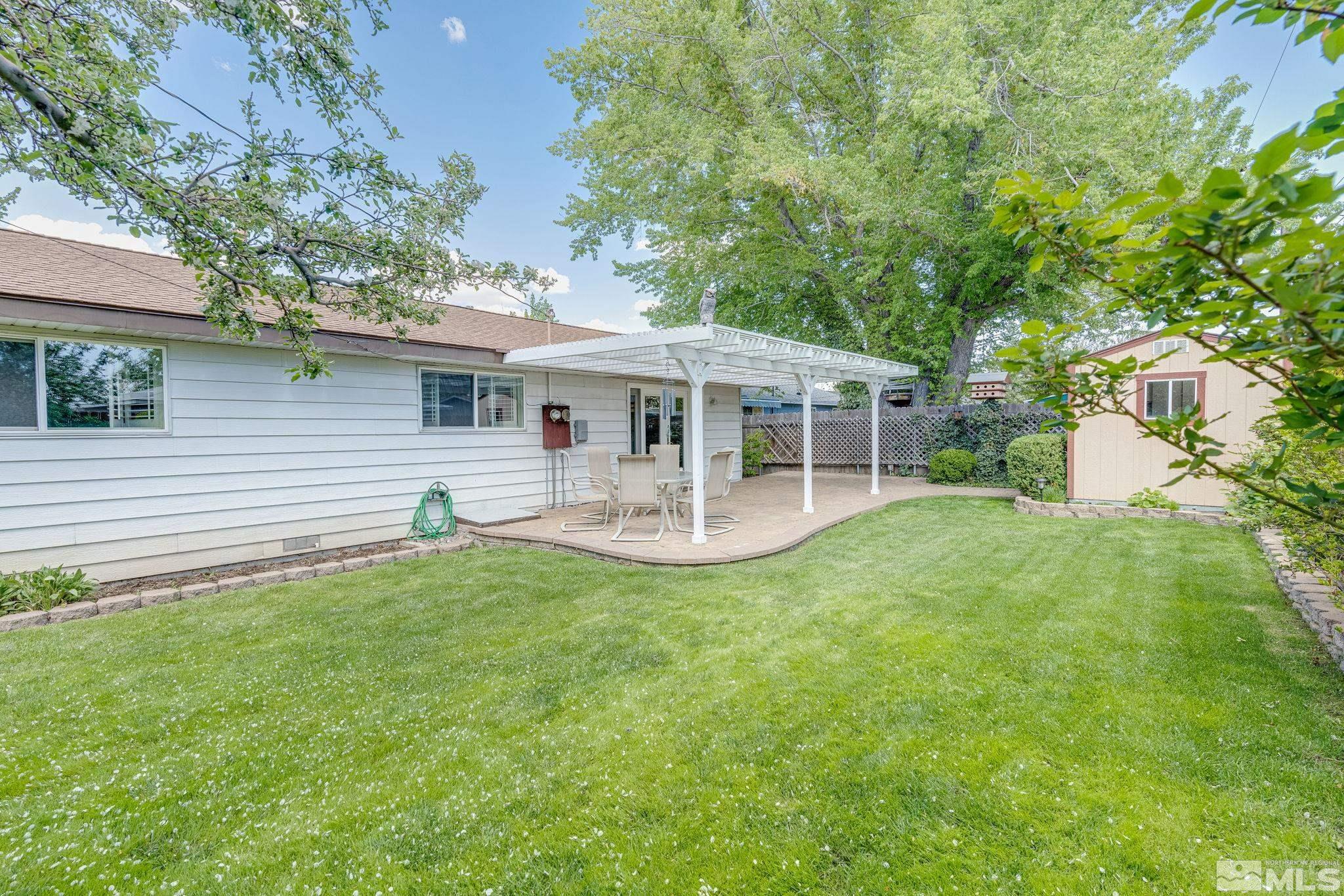 1065 Beldon Way Reno, NV 89503 - Photo 35 of 35 a view of a house with a backyard and a patio