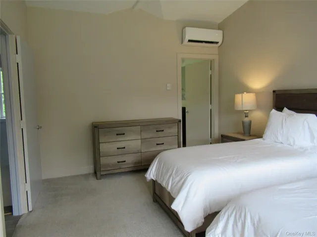 a bedroom with a bed and a cabinets