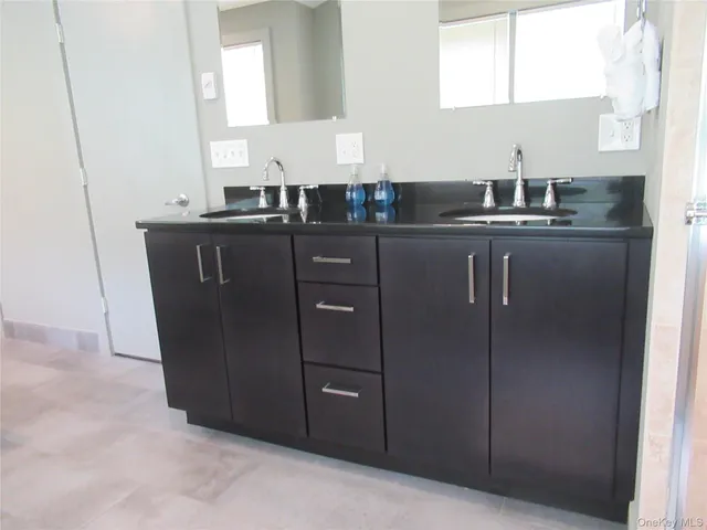 a kitchen with a sink and cabinets