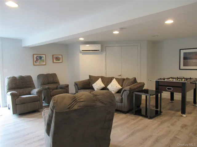a living room with furniture and a piano