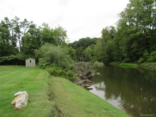 a view of a golf course with a lake