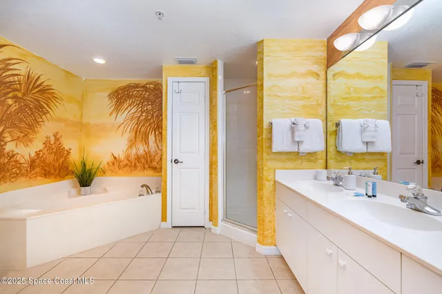 a bathroom with a tub sink and a shower