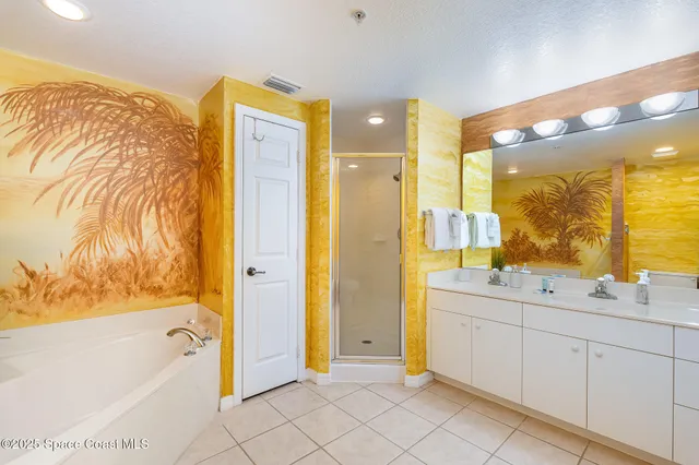 a spacious bathroom with a tub sink and mirror