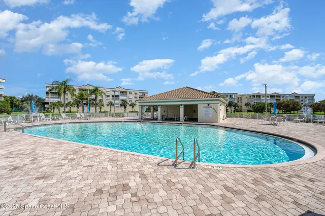 a view of a swimming pool and a yard