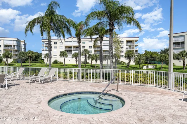 a dining hall with a dining table and chairs