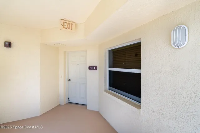 a view of a elevator and an empty room