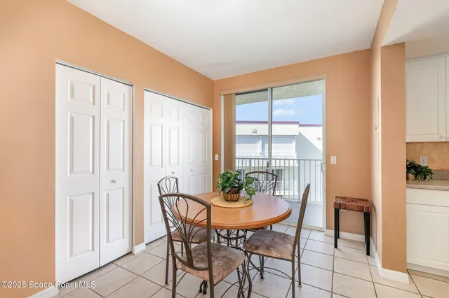 a view of a dining room with furniture and window