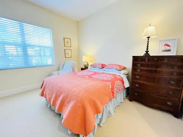 a bedroom with a bed and a night stand