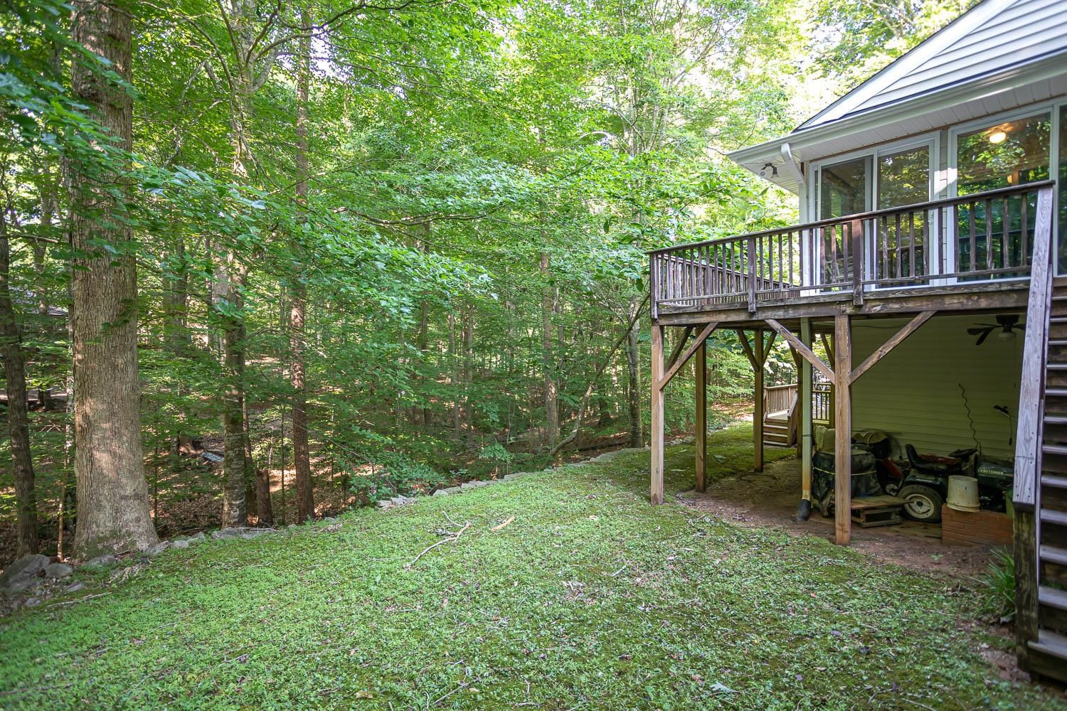 14401 Possum Track Road Raleigh, NC 27614 - Photo 19 of 30 Partial view of back yard and huge wrap around wood deck! Deck