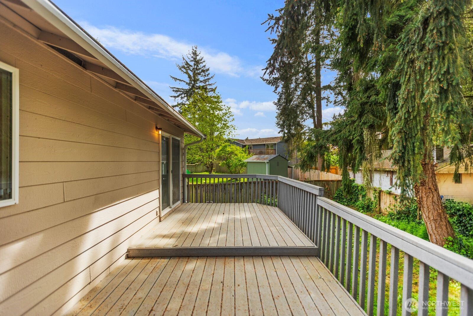 21627 9th Place West Bothell, WA 98021 - Photo 37 of 40 a balcony with view of trees in front of it