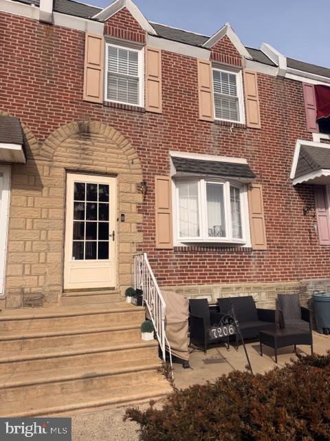 7206 Montague Street Philadelphia, PA 19135 - Photo 1 of 15 a front view of a house with stairs