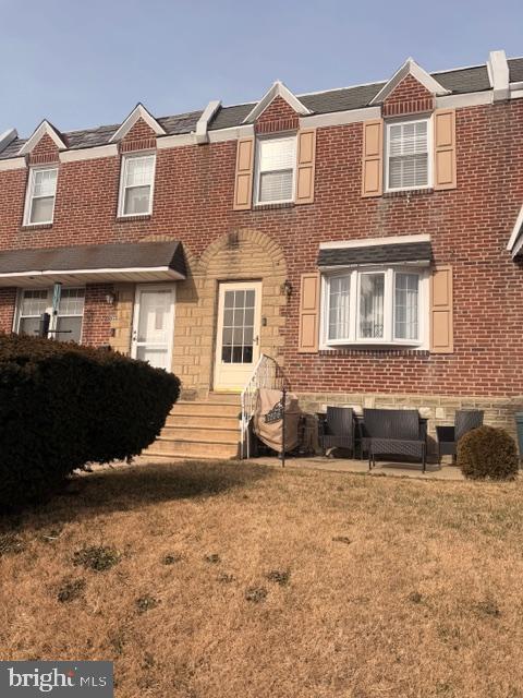 7206 Montague Street Philadelphia, PA 19135 - Photo 15 of 15 a front view of a house with a yard