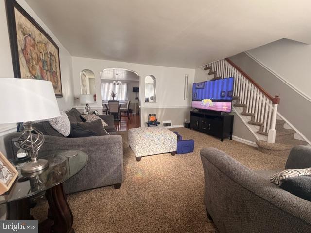 7206 Montague Street Philadelphia, PA 19135 - Photo 2 of 15 a living room with furniture and a couch