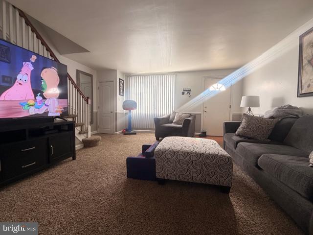 7206 Montague Street Philadelphia, PA 19135 - Photo 3 of 15 a living room with furniture and a flat screen tv