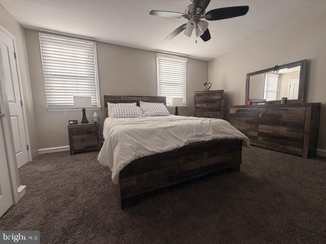 7206 Montague Street Philadelphia, PA 19135 - Photo 10 of 15 a spacious bedroom with a bed and a chandelier