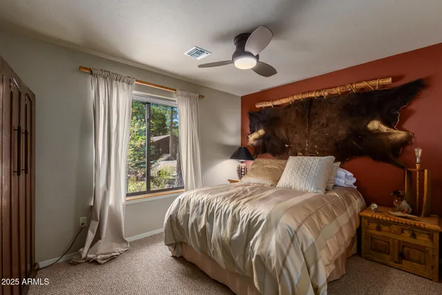 a bed room with a bed and a window