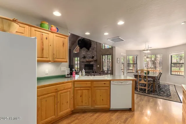a kitchen with stainless steel appliances granite countertop a sink and cabinets